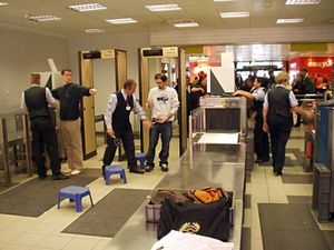 Baggage is scanned using X-ray machines, passe...