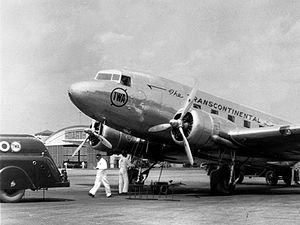 A TWA Douglas DC-3 airplane is prepared for ta...